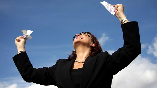 business woman celebrating on a blue sky background