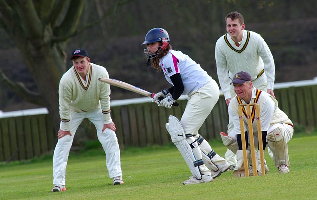 woman playing cricket with men