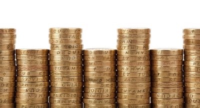 piles of pound coins, gender pay gap