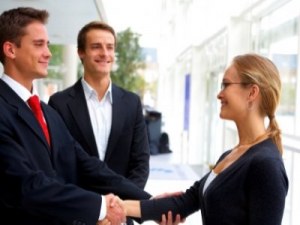 business men shaking womans hand featured - Women Returners