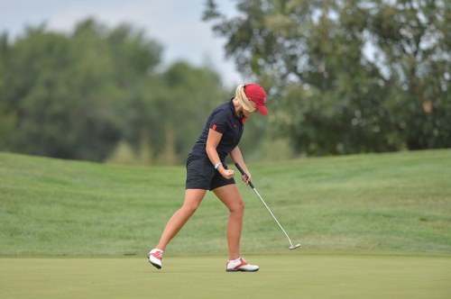 female golfer playing at golf club