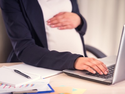 A pregnant business woman - Managing maternity