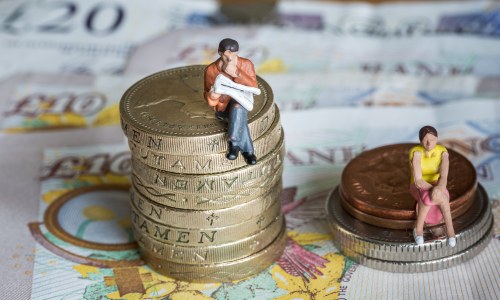 man-and-woman-sat-on-money-piles-gender-pay-gap, equal wages