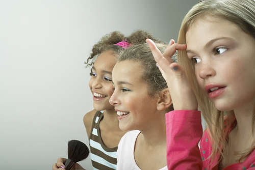 girls fixing their make up, beauty not brains