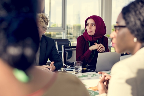 muslim lady wearing a headscarf at board meeting