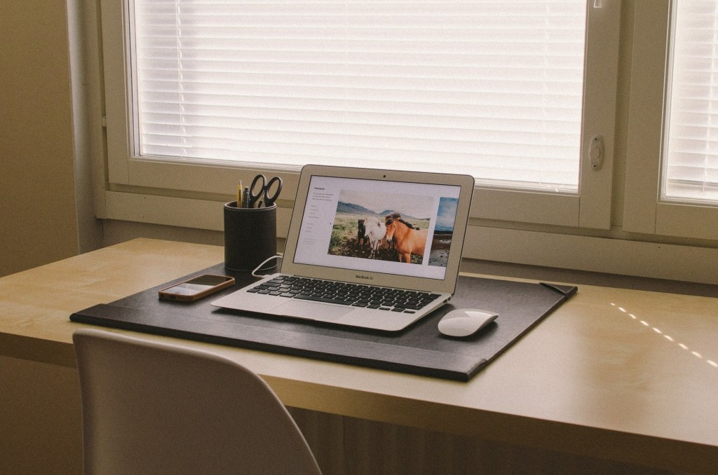 Desk set up with a computer, working remotely